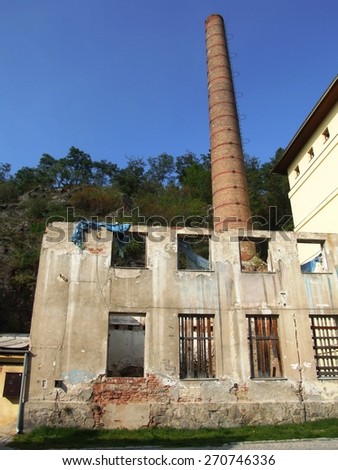 Ruins of old factory with high chimney in Trebic, Czech Republic