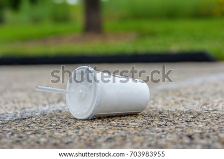 Similar – Image, Stock Photo Plastic straws thrown in ocean. Pollution concept. Flat lay on pink background