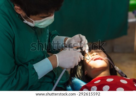 CHIANG RAI, THAILAND -MARCH 29 2015: Unidentified dentist volunteer from public hospital are in medical services at Ban Huai Ya Sai school on March 29,2015 in Chiang rai,Thailand.