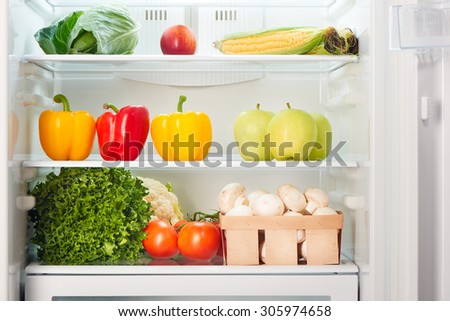 Open refrigerator full of fruits and vegetables. Weight loss diet concept.