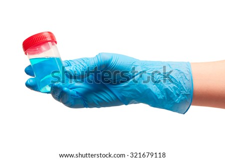 Close up of female doctor\'s hand in blue sterilized surgical glove holding transparent plastic sterile specimen collection container with red cap filled with blue liquid against white background