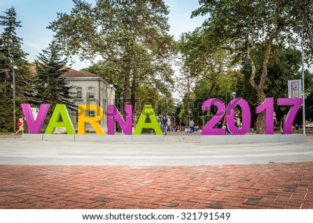 Varna,Bulgaria - September 22nd, 2015: People ar walking behind the sign: 