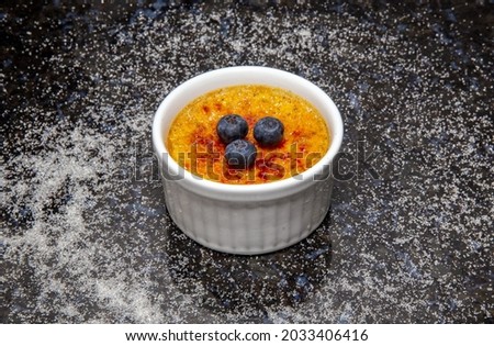 Similar – Image, Stock Photo Cream brulee on dark wood