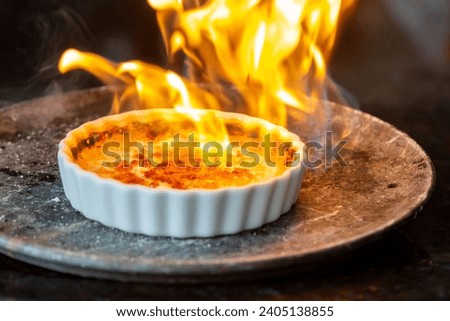 Image, Stock Photo Creme brulee with caramel crust. Burning sugar on burnt cream