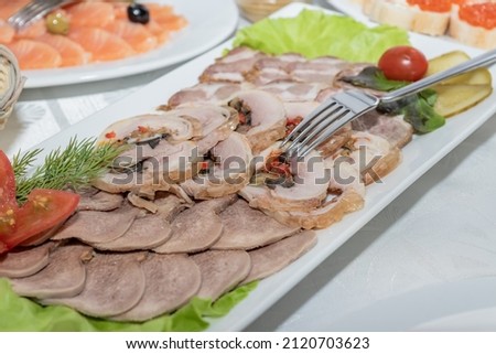Delicatessen assortie on a plate at the restaraunt. Meat appetizer selection Photo stock © 