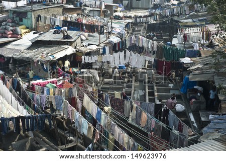 MUMBAI, INDIA - OCT 15: Colorful wet clothes washed by the laundrymen at the Dhobi Ghat on 15 October 2012 in Mumbai. It is the the largest outdoor laundry in the world with 700 washing platforms
