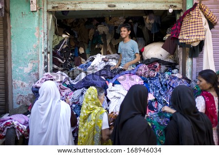 JODHPUR, INDIA - JAN 15: Unidentified local women shop at a clothes store in the main market under the clock tower on January 15, 2013 in Jodhpur, India. Jodhpur is know as the blue city.