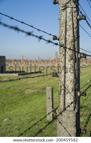 AUSCHWITZ, POLAND - OCT 29: The fence and the houses of the infamous Auschwitz II-Birkenau, a former Nazi extermination camp and now a museum on October 29, 2013 in Oswiecim, Poland