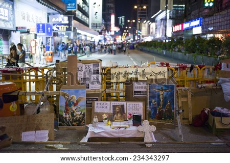 HONG KONG - OCT 15: A catholic church is set up in the middle of the road as barricades in Mongkok in Hong Kong on October 15 2014. Mongkok is the busiest district in Hong Kong.