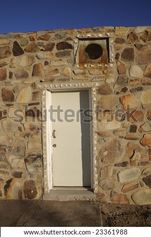 Old Door In an older rock building with sky