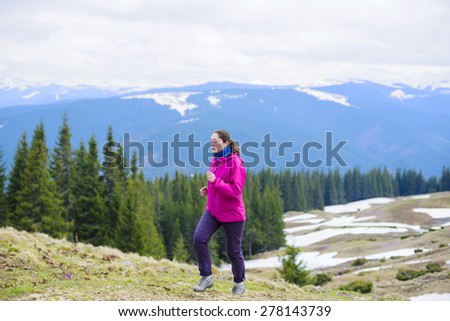 Female running athlete. Woman trail runner sprinting for success goals and healthy lifestyle in amazing nature landscape