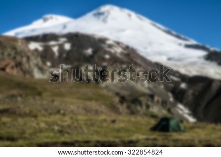 Blurred nature background. Beautiful mountains panorama blurred and filtered