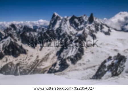 Blurred nature background. Beautiful mountains panorama blurred and filtered