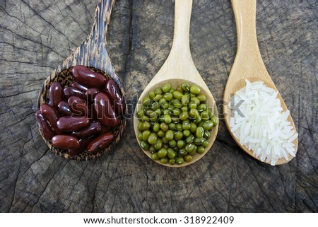 Green beans and Red bean and Rice  in the wooden spoon on wood background.