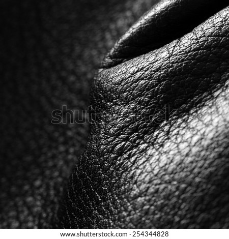 Elegant black jacket detail. Close up photo, nice light and fabric texture detail.