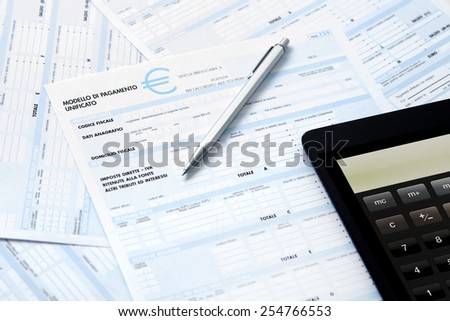 Tax form and financial issues conceptual image. Original Italian tax form in the photo.