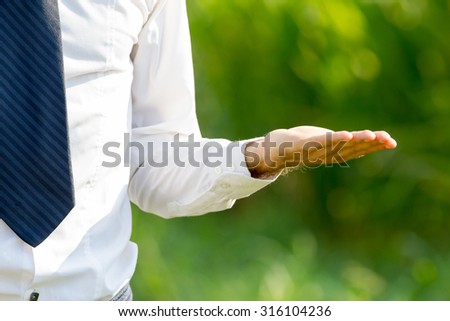 Businessman outdoor with copy space gestures