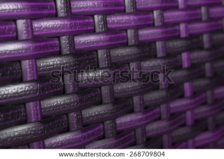 Color synthetic rattan texture weaving background. Closeup of synthetic rattan weave texture as used on outdoor garden furniture . Modern colors. Useful as background or texture