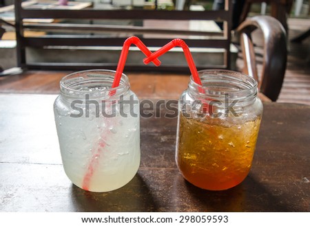 Two glass have lemon soda and honey lemon juice sweet in drink shop