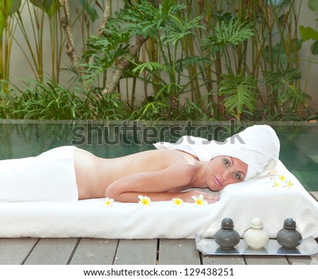 The young beautiful woman on Spa procedures in pool