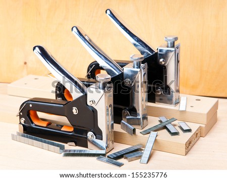 stapler for repair work in the house and on furniture, and brackets