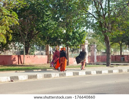 JAIPUR,INDIA - JANUARY 29: Women in bright saris going on the street on January 29, 2014 in Jaipur, India.