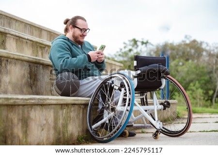 Similar – Image, Stock Photo Disabled athlete using phone