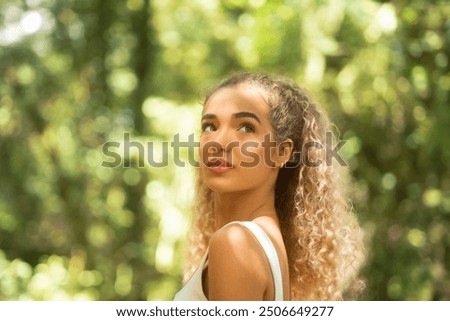 Similar – Foto Bild Gelassene Frau mit lockigem Haar im Studio