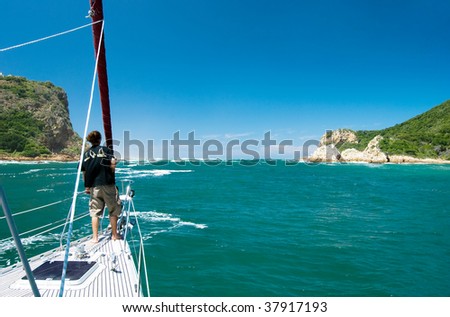 Sailing away through the bay on a beautiful yacht