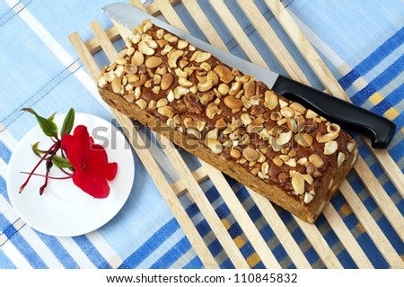 Ginger bread with nuts and a red flower