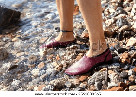 Similar – Image, Stock Photo Woman on stony seashore looking on foamy water washing peaks