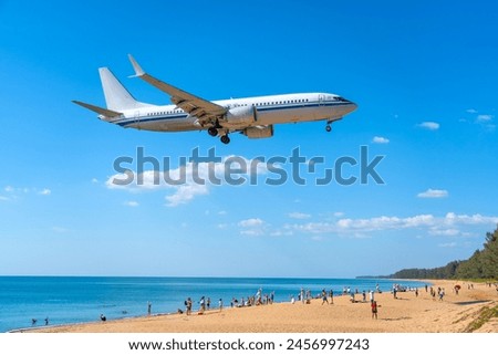 Similar – Image, Stock Photo Airplane landing above beautiful beach and sea background