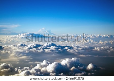 Clouds from above the sky blue space flight