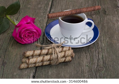 festive card, coffee and red rose and linking of cookies, still life on a subject flowers and drinks