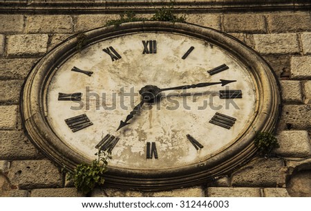 clock on the old stone tower