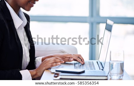 Similar – Image, Stock Photo Anonymous black businesswoman using smartphone at home