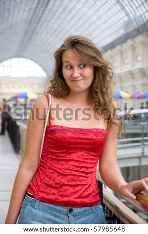 portrait of doubting woman in mall