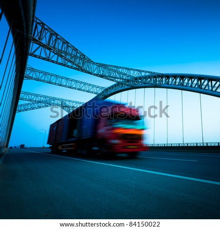 speeding truck go through the bridge.