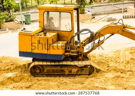 track-type loader excavator machine doing construction zone  work  sand for construction