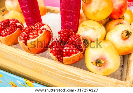 Pomegranate fruit. Pomegranates In an ice bucket. Organic Bio fruits