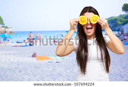 Woman On A Beach Covering Eyes With Lemon, Outdoor