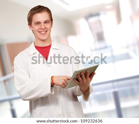 Portrait of a doctor using a tablet, outdoor