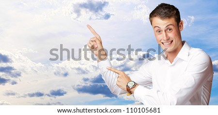 Portrait Of Handsome Mature Man Pointing Up Over, Outdoor