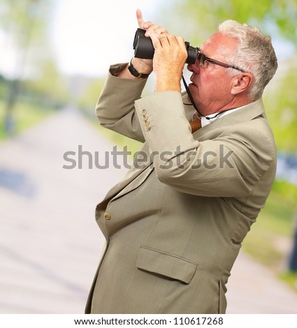 Senior Man Looking Through Binoculars, Outdoor