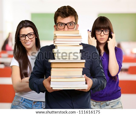 Student Carrying Stack Of Books, Indoor