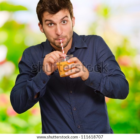 Young Man Drinking Juice, Outdoor