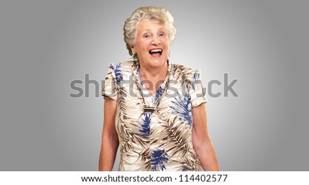 Portrait Of A Senior Woman Happy On gray Background
