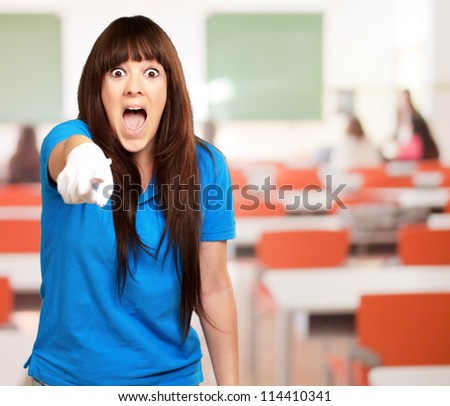 woman screaming and pointing finger, indoor