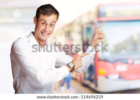 Portrait Of Handsome Mature Man Pointing Up Over, Outdoor