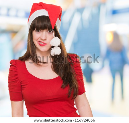 funny woman wearing a christmas hat, indoor
